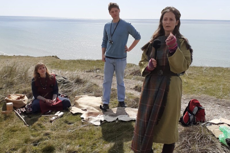 Actors at Hengistbury Head showing people the history of the region