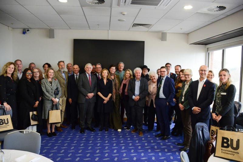 A large group of people who are partners of the Bournemouth University Harmony Centre