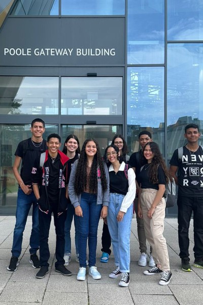 Students from Brazil standing in front of the BU Poole Gateway Building