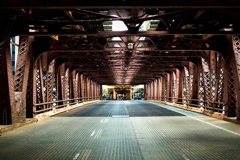 Bridge A view of a road running over a bride with large metal structures at the sides and at the top
