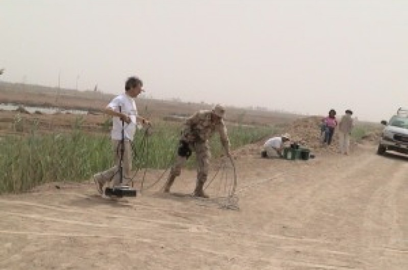 BU researchers assess mass graves, South of Baghdad, 2003.