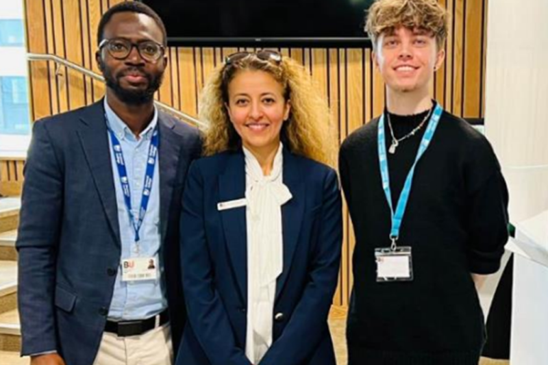 Three people looking at the camera smiling