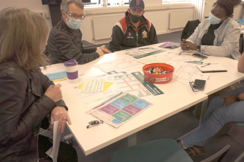 Students sit around a table as part of EDfest 