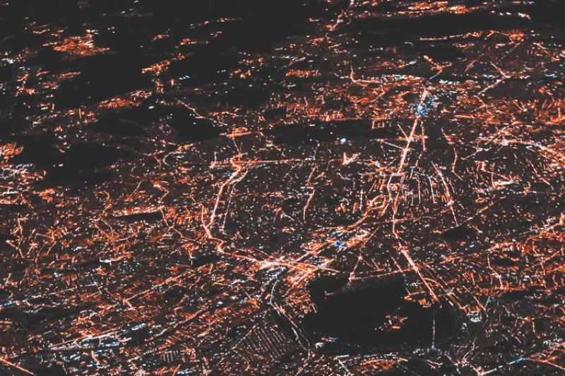An aerial image of a city lit up at night