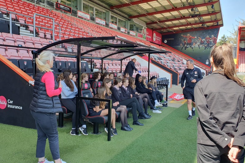 Students from Ferndown Upper sat on the bench at the Vitality Stadium