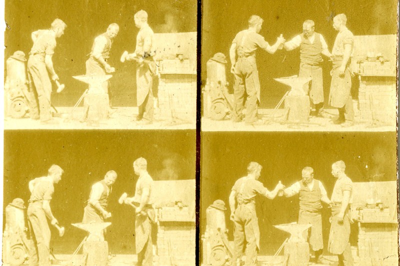 4 very similar images, in square formation depicting three men in blacksmith's aprons standing by an anvil in the front of what looks like a blacksmith's shop