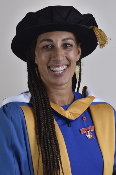 Geva Mentor Robed Geva Mentor, head a shoulders photo, wearing her ceremonial graduation cap