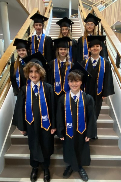 Pupils in their graduation gowns