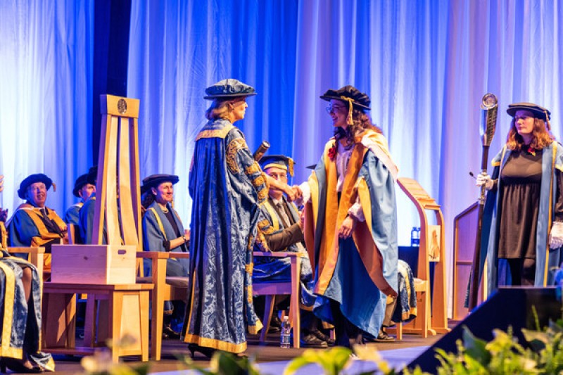 Graduation 2022 - Honorary graduate Alice Tai onstage receiving award Graduation 2022 - Honorary graduate Alice Tai onstage receiving award