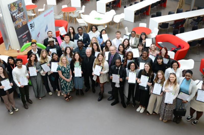 BU students holding their awards