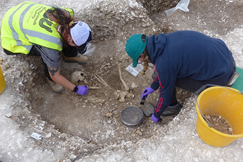 Students excavating human remains