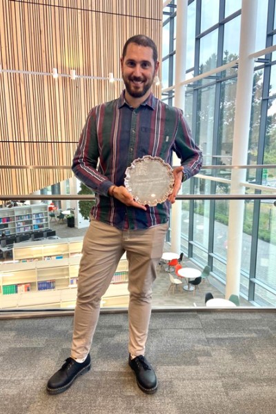 Georgios Romanakis receiving his Sarah Cheeseman Compassionate Care award Georgios Romanakis holding his HSS award