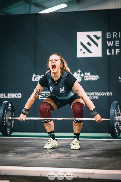 Izzy Sperry during a lift with a bar weight