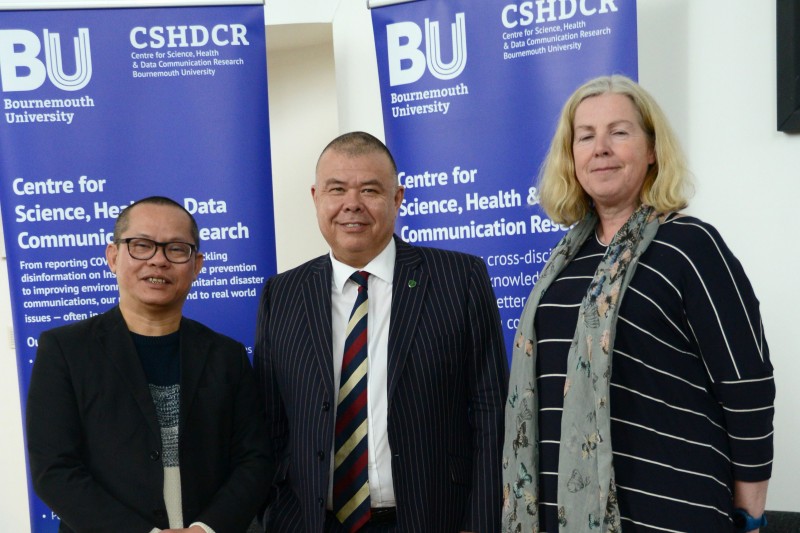 An Nguyen, JVT and Ruth Williamson standing in a row, smiling at the camera