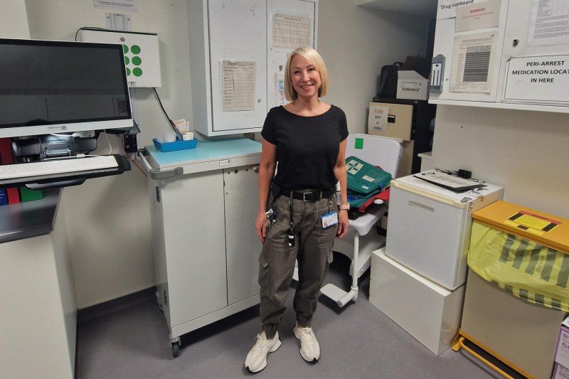 Jo Parker standing in a clinical room.