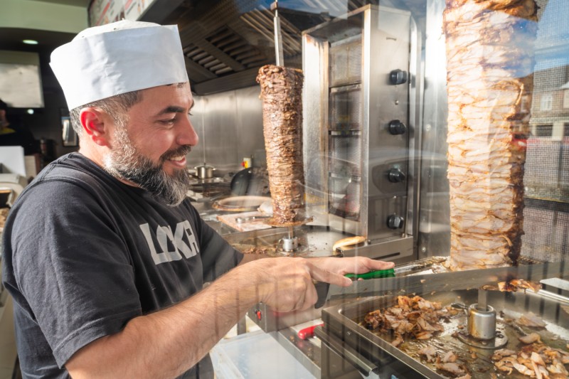 Worker in local kebab restaurant Worker in a local Kebab restaurant