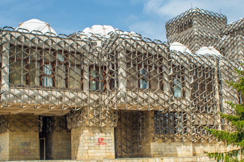 The exterior of a library in Kosovo. We work closely with the University of Pristina in Kosovo to enable shared education, learning and practice for our community. The exterior of a library in Kosovo. We work closely with the University of Pristina in Kosovo to enable shared education, learning and practice for our community.