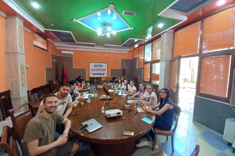 Participants in the beats and lyric making workshop sat around a table 