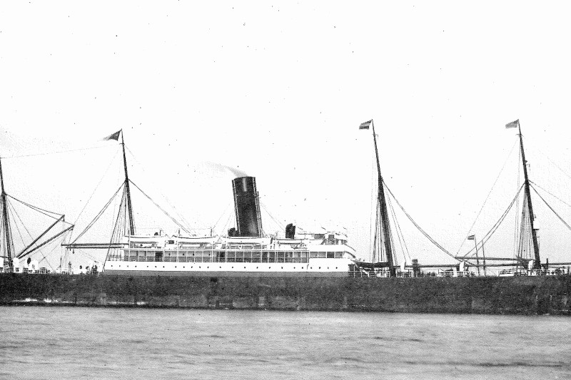 A black and white image of SS Mesaba on the ocean - a large merchant liner with four masts and a large funnel