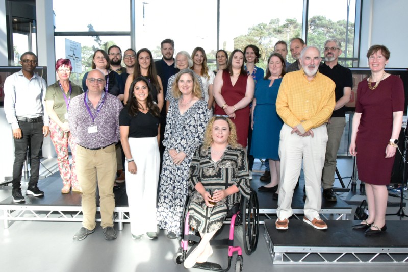 A group photo of the BU Humanities and Law department staff on stage