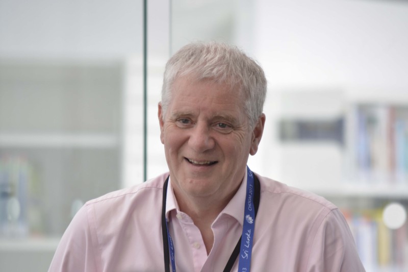 A head and shoulders profile photo of Sir Martin