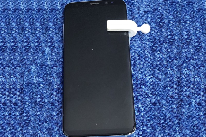 A smartphone with the NERVE device attached A smartphone with the NERVE device attached