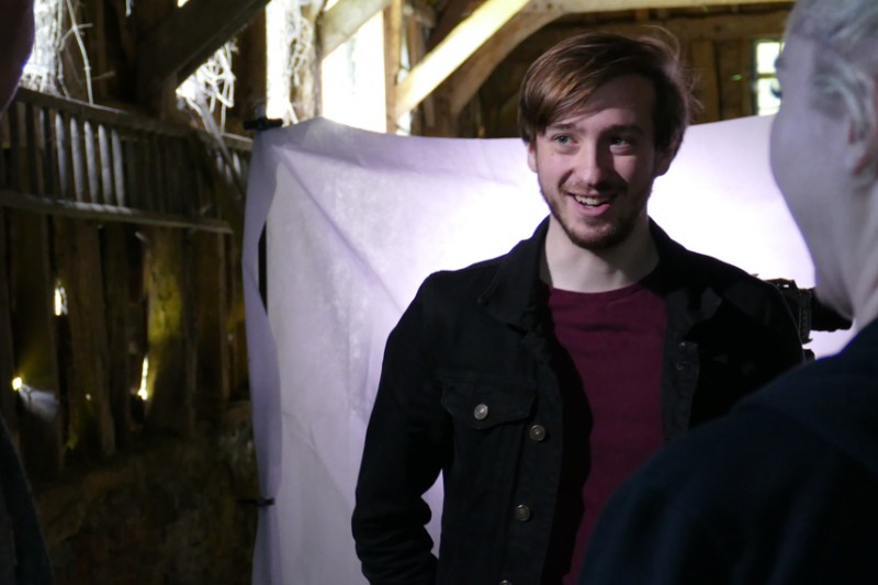 Nick Zerafa on the set of 'Your Country Needs You' (a barn location) with a female colleague in the foreground