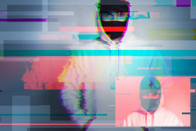 Creative image with a man in a balaclava and glitch and interference effects