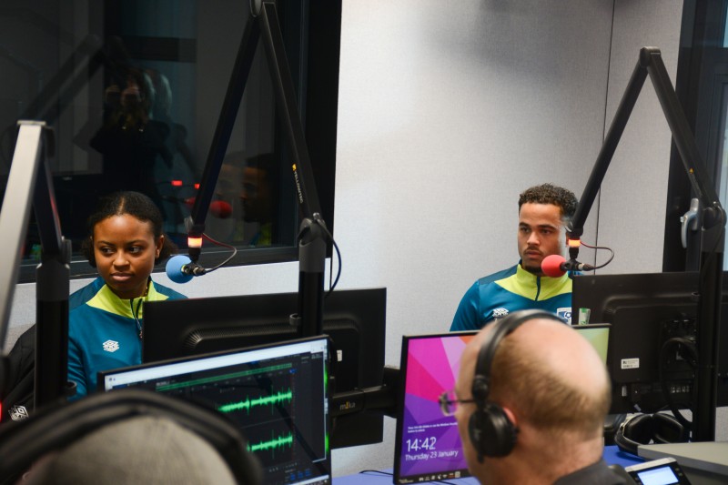 Justin Kluivert and Kenni Thompson speaking in the radio studio