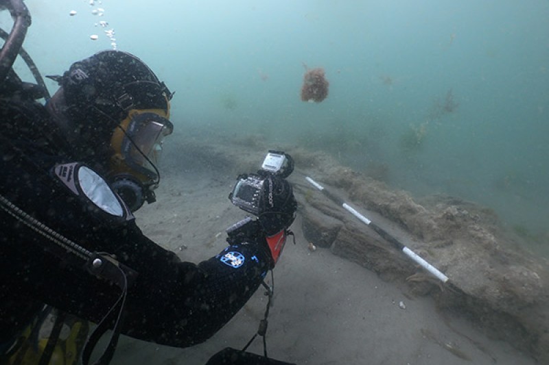Diver surveys the uncovered rudder of HMS Invincible