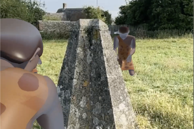 An augmented reality view on a mobile phone screen showing a real stone with animated images of prehistoric people around it. 
