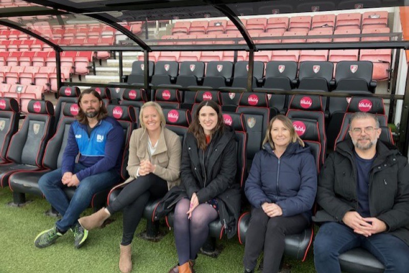 BU and AFCB staff seated at the stadium BU and AFCB staff seated at the stadium