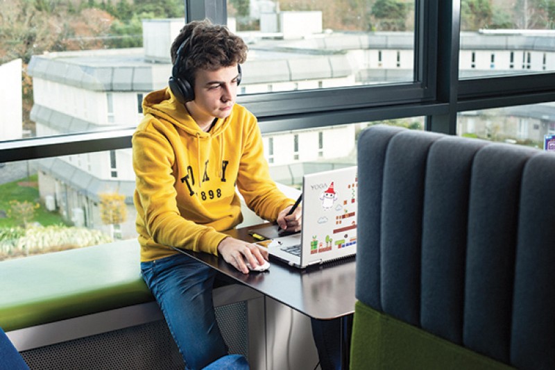 student using laptop in Student Centre