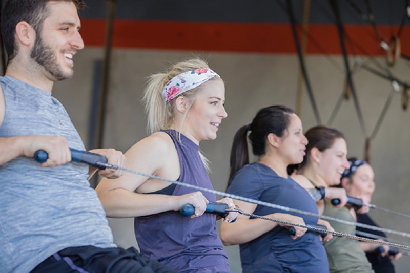 People using rowing machines People using rowing machines