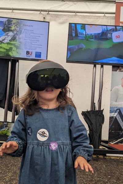A young visitor to the stand tests out the VR headset experience A young visitor to the stand wearing a virtual reality headset