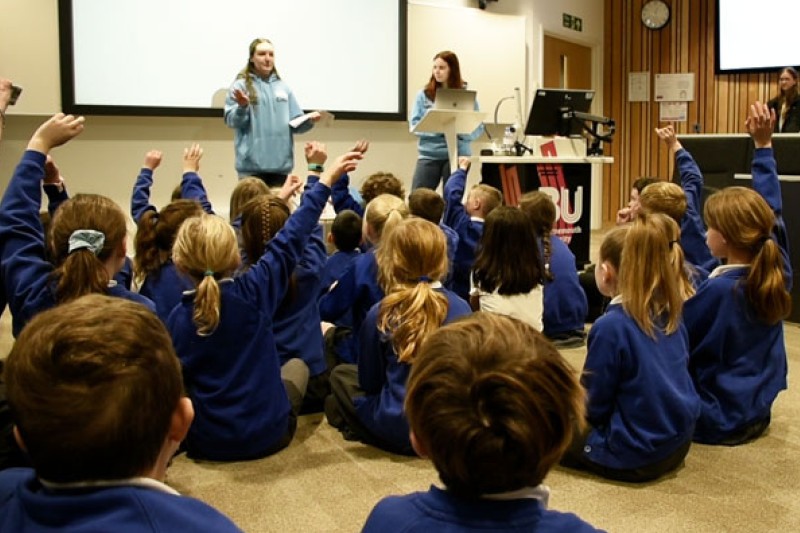 Volunteer BU Students addressing pupils from Longfleet Church of England Primary School