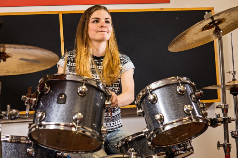 A Bournemouth University student playing the drums