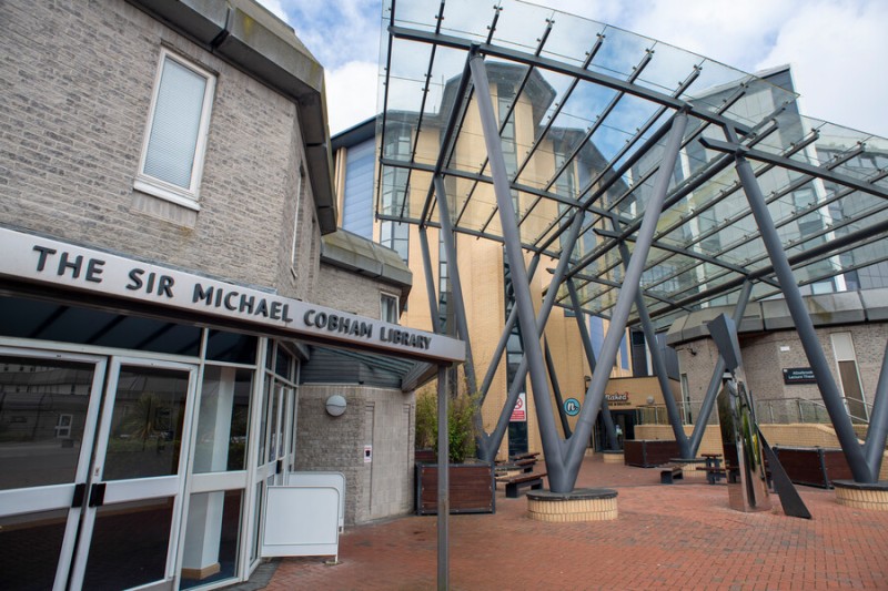 A close up of The Sir Michael Cobham Library entrance on Talbot Campus
