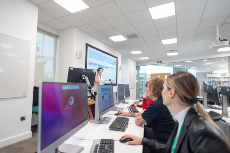 A member of the library team is delivering a study skills workshop to a group of students