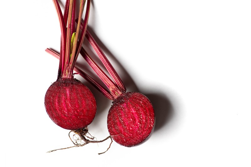 This picture contains an image of a beetroot sliced in half