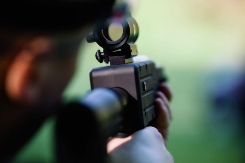 Image of a marksman holding a rifle