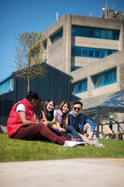 International students outside poole house