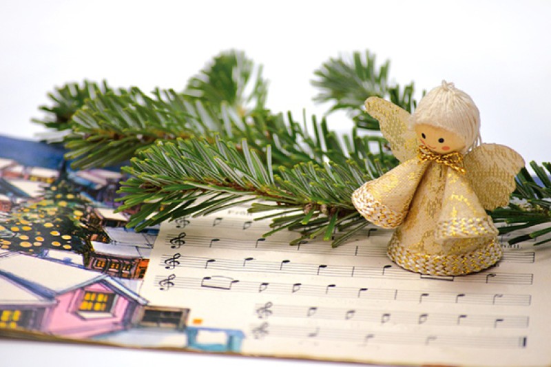 Christmas sheet music and angel decoration Christmas sheet music and angel decoration