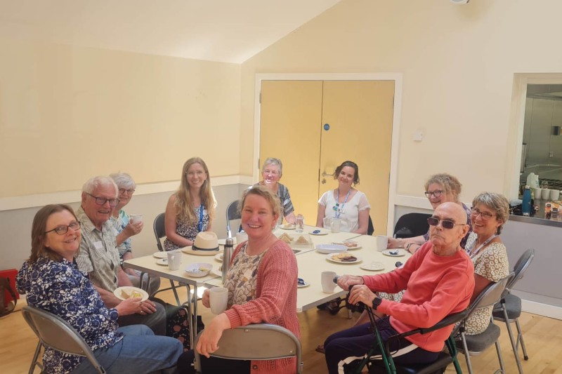 A group of workshop attendees sat around a table