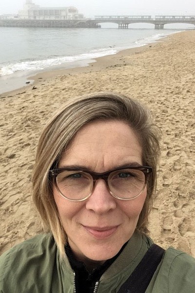 Emma Walters, EdD graduate, on Bournemouth beach