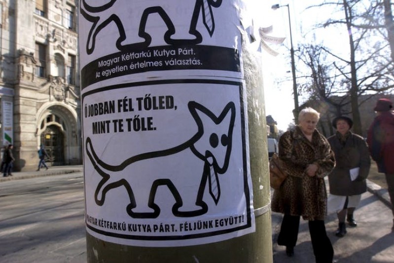 A Two-Tailed Dog sticker appears on a Budapest lamp post.