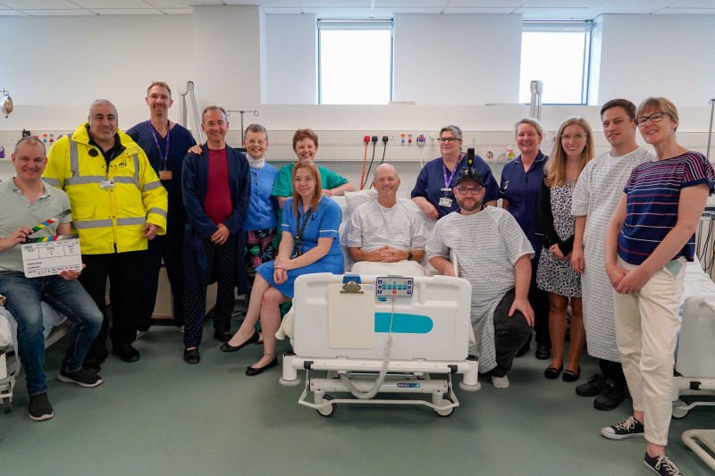 The Insight Dementia filming team stood around a hospital bed