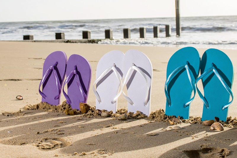 Flip flops standing in the sand