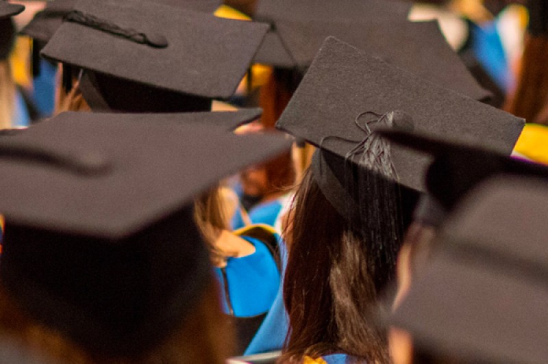 Students in the audience at a graduation ceremony