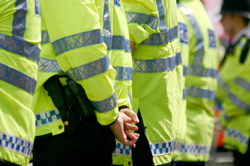 Police three police officers wearing high visability jackets